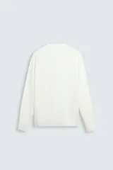 Jersey color topo de corte amplio, tejido en hilatura con mezcla de viscosa. Tiene cuello redondo, manga larga y terminaciones en rib.