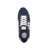 Championes urbanos Etnies Calli Vulc, con capellada combinada en lona gris y gamuza verde oscuro, logo blanco en el lateral, detalles en naranja y suela vulcanizada blanca.