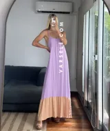 Vestido largo verde oliva con breteles finos regulables y corte a la cadera con volado color beige.