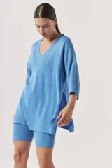 Shorts tipo biker de tejido de punto color beige melange, ajustados al cuerpo.