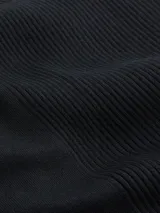 Falda larga negra de lyocell de canalé, con cintura elástica, abertura lateral y logo de Calvin Klein en la cintura.