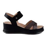 Sandalias negras de plataforma con taco corrido, tiras cruzadas con glitter y pulsera con hebilla en el tobillo.