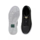 Championes Puma Cali Court negros con detalles en verde y suela blanca con plataforma.