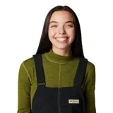 Pantalón tipo jardinero negro de softshell con tirantes ajustables, cierre frontal con cremallera, bolsillos laterales con cremallera y bolsillo en el pecho.