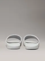 Chancletas Calvin Klein blancas con logo de la marca estampado en jacquard en la tira.