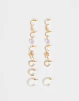 Set de seis pares de aros argollas doradas con diferentes dijes: flor, corazón, moño, argolla simple, argolla con strass y argolla con perlas.