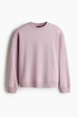 Buzo de tejido de mezcla de algodón de peso medio con interior cepillado suave. Modelo con cuello redondo ribeteado, hombros caídos y remate acanalado ancho en puños y bajo.