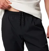 Pantalón de jogging negro con logo de Columbia en blanco en el muslo.