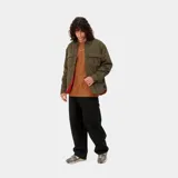 Pantalón de lona Marshall color marrón, con un corte holgado y voluminoso, paneles anchos en las rodillas y bolsillos utilitarios.