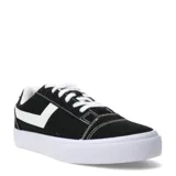 Championes de lona negros con suela blanca, cordones blancos y logo lateral blanco. Diseño de corte bajo y estilo urbano.