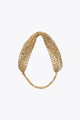 Diadema color dorado con abalorios y brillos combinados, con banda elástica cubierta de tela.
