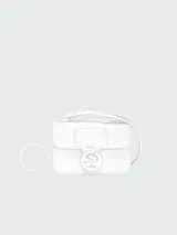 Bandolera Longchamp modelo Box-Trot XS, color fucsia, con correa fina ajustable y logo circular metálico en el frente.