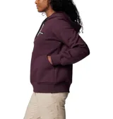 Buzo Columbia de mujer, modelo Marble Canyon Hoodie, color borgoña. Confeccionado en tejido elástico con interior cepillado suave, capucha ajustable con cordón, bolsillo tipo canguro y puños acanalados.