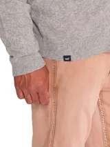 Sweater celeste de punto con cuello alto y cierre frontal completo.