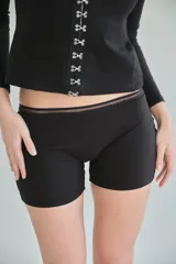 Boxer negro de algodón peruano con detalle de red en la cintura.