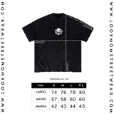 Camiseta oversize marrón con efecto acid wash y estampado frontal blanco con la leyenda "Lookmom Studios".