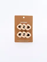 Set de dos broches para el pelo color beige con forma de eslabones de cadena.