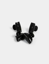 Set de cuatro broches para el pelo color negro, dos con acabado mate y dos con acabado brillante.