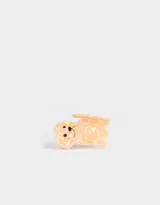 Broche de pelo color rosa claro con forma de perro y detalles en negro y amarillo.