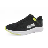 Championes Puma FTR Connect negros con detalles en amarillo flúor y suela blanca.
