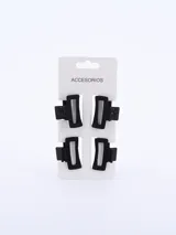 Set de cuatro pinzas negras para el pelo, de forma rectangular con bordes redondeados.