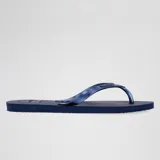 Ojotas Havaianas modelo Elegance, color azul marino oscuro, con tiras delgadas y logo metálico de la marca. La suela es antideslizante y la plantilla ergonómica.