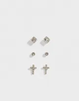 Set de tres pares de aros pasantes bañados en plata: un par con strass redondo, un par con forma de cruz con strass y un par con strass cuadrado.