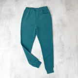 Jogger de algodón sin felpa, con cintura elástica y puños, en color verde inglés.