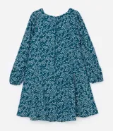 Vestido corto de crepé color verde azulado con estampado de mini corazones blancos, escote en pico, mangas largas con puños elásticos y cierre en la espalda.