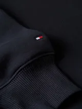 Buzo azul marino con capucha y cordón ajustable, de corte regular. Presenta el logo de Tommy Hilfiger bordado en el pecho y la bandera de la marca en el puño.