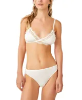 Bralette blanco con copas triangulares de tela suave y detalles de encaje transparente con ribete de pestañas.