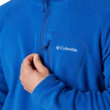 Polar de hombre Columbia Fast Trek III, color azul brillante, con cuello alto y cierre frontal parcial (half-zip). Presenta un bolsillo con cierre en el pecho.