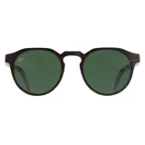 Lentes de sol tipo aviador con armazón de ebanizado y lentes polarizados verdes.