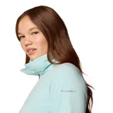 Buzo polar blanco de mujer, con cuello alto y cierre de media cremallera.