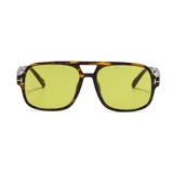 Lentes de sol unisex con montura cuadrada de carey y lentes amarillas.