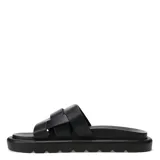 Sandalias bajas negras con tiras anchas cruzadas en la parte superior.