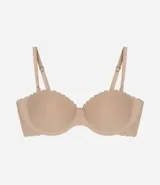 Soutien femenino liso color piel, modelo top sin tirantes, con relleno y borde festoneado.