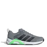Championes Adidas grises con las tres tiras negras a los costados y detalles en verde neón.