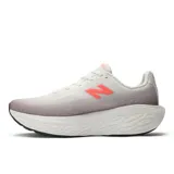 Championes New Balance para running, modelo 1080 V14, color blanco con detalles en gris y rosa.