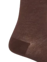 Calcetines largos de color marrón con detalles en beige y logo de la marca RKF.
