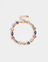 Pulsera dorada flexible con strass en tonos violeta, rosa, celeste y cristal.