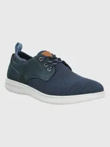 Zapatilla urbana Hush Puppies modelo Port, color tostado, con capellada de cuero y malla, cordones y suela con tecnología ZeroG de EVA.