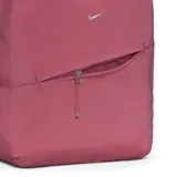 Mochila Nike Aura unisex color rosado, con logo plateado y bolsillo frontal con cierre.