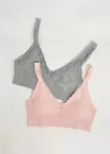 Pack de dos soutiens modelo top, sin aro, con copas removibles, sin costura y breteles ajustables. Uno es de microfibra celeste con encaje blanco y el otro es gris jaspeado con encaje gris.