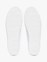 Zapatillas Tommy Hilfiger blancas de lona, con suela de goma vulcanizada, talón metalizado color dorado y logo de la marca bordado en el lateral.