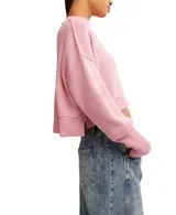 Sweater negro corto de punto acanalado con cuello alto, mangas abullonadas y corte holgado.