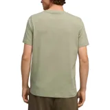 Remera verde claro de algodón, corte clásico, cuello redondo y logo Puma estampado en el pecho.
