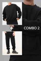Conjunto deportivo negro compuesto por un buzo de cuello redondo y un pantalón jogging con cintura elástica y puños ajustados.