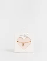 Cadena corta dorada con dije de la letra A cubierto de strass.