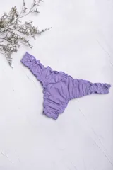 Vedetina de algodón color beige melange, con terminaciones fruncidas y corte less.